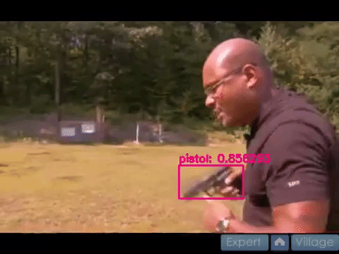 Video clip overlayed with model predictions showing a detected pistol in a man's hands.