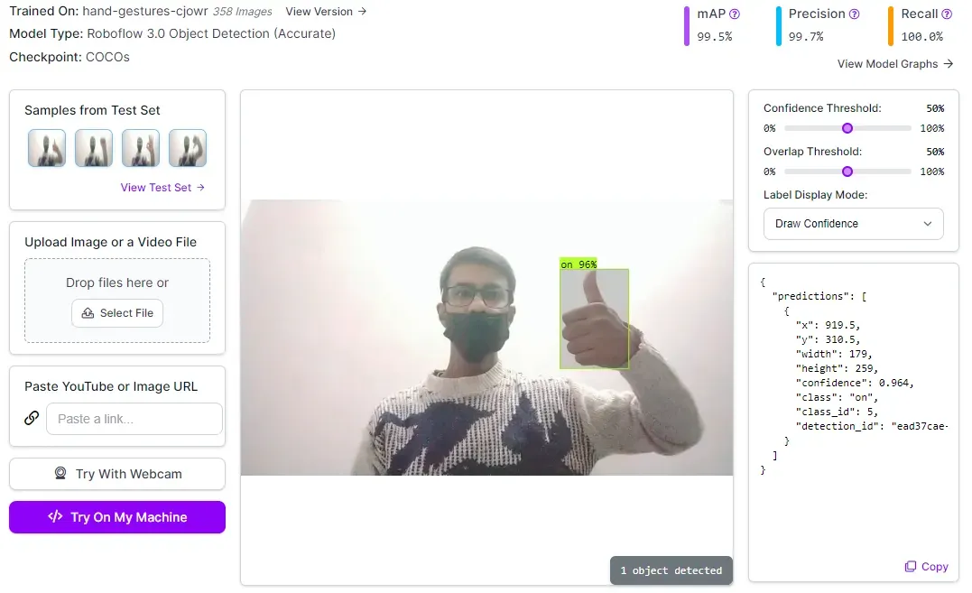 A person with a beard and glasses holding up his thumb

Description automatically generated